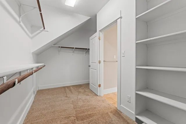 a view of an empty walk in closet