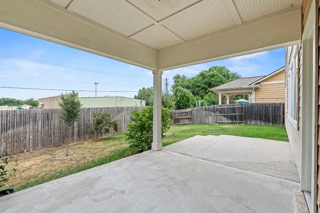 a view of backyard with green space