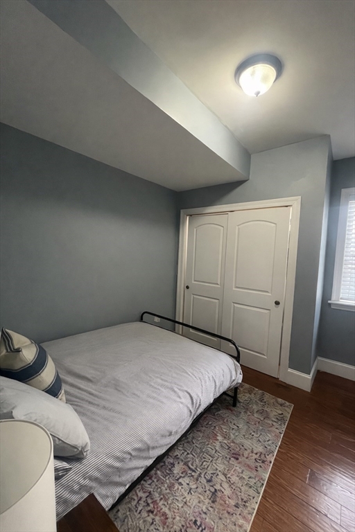 42 R Olney Street, Unit 2 Boston, MA 02121 - Photo 11 of 17 a bedroom with a bed and a walk in closet