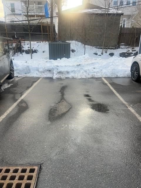 42 R Olney Street, Unit 2 Boston, MA 02121 - Photo 16 of 17 a view of parking area and a car parked on road