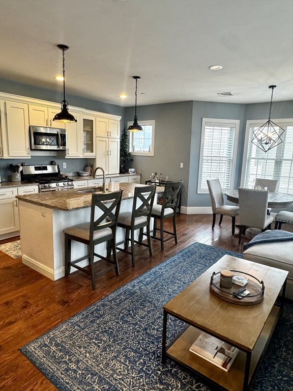 42 R Olney Street, Unit 2 Boston, MA 02121 - Photo 3 of 17 a living room with furniture and a wooden floor