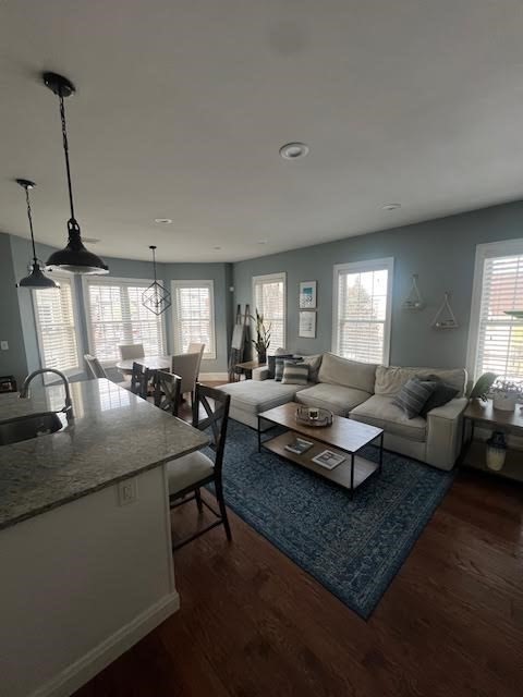 42 R Olney Street, Unit 2 Boston, MA 02121 - Photo 5 of 17 a living room with patio furniture and a wooden floor