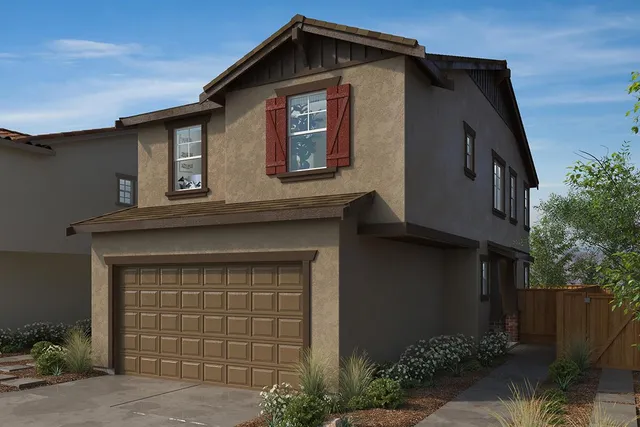 a front view of a house with garage