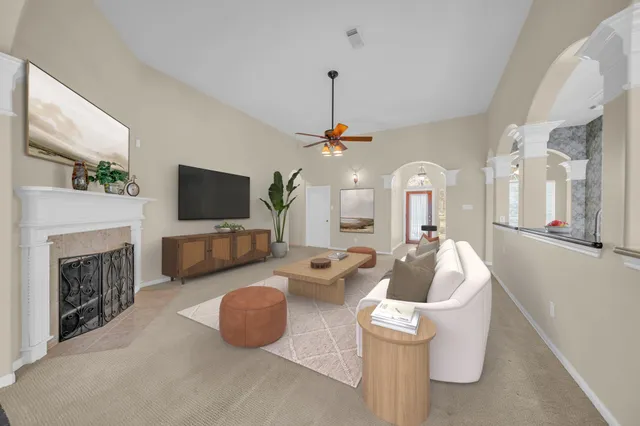 a view of a room with chandelier and fireplace