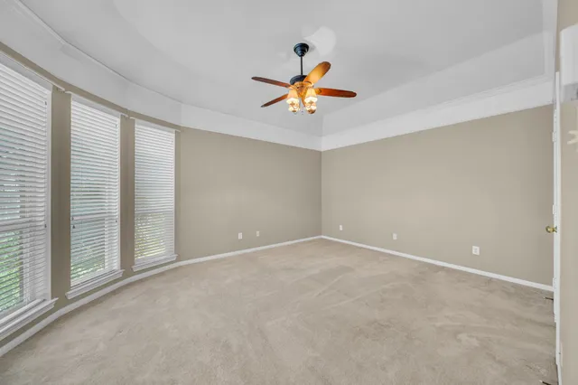 a large white bathroom with a double vanity sink mirror and bathtub