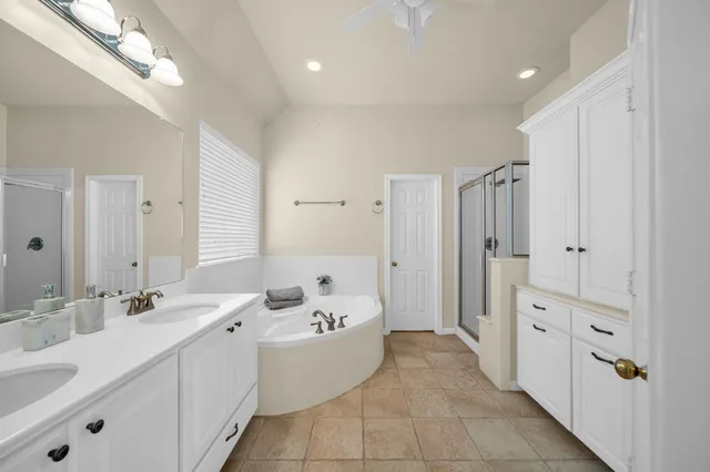 a view of walk in closet with white walls