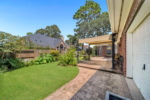 a front view of a house with a yard table and chairs