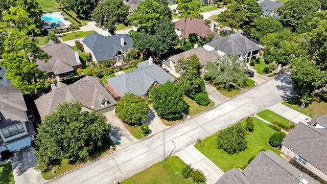 an aerial view of a house with outdoor space