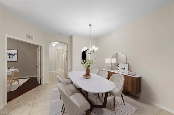 a dining room with a table and chairs