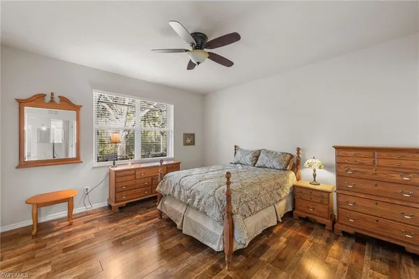 a bed room with a bed and a window