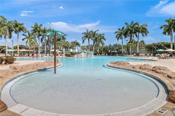 a view of a swimming pool with a yard