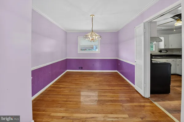 a view of a hallway with a chandelier