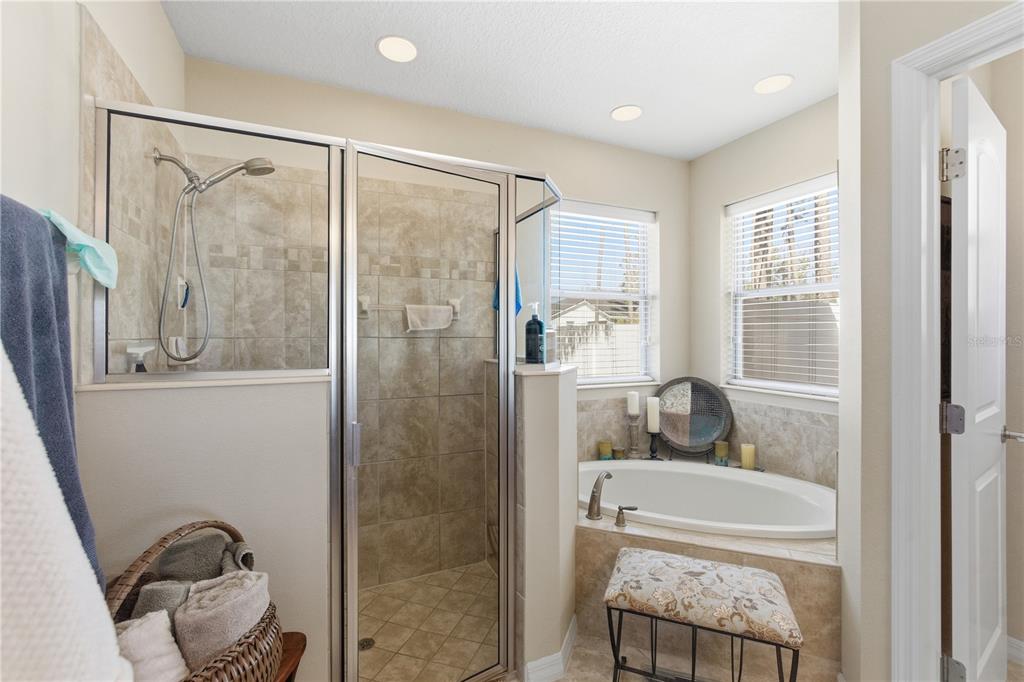 48 Evans Drive Palm Coast, FL 32164 - Photo 20 of 47 a bathroom with a tub shower and sink