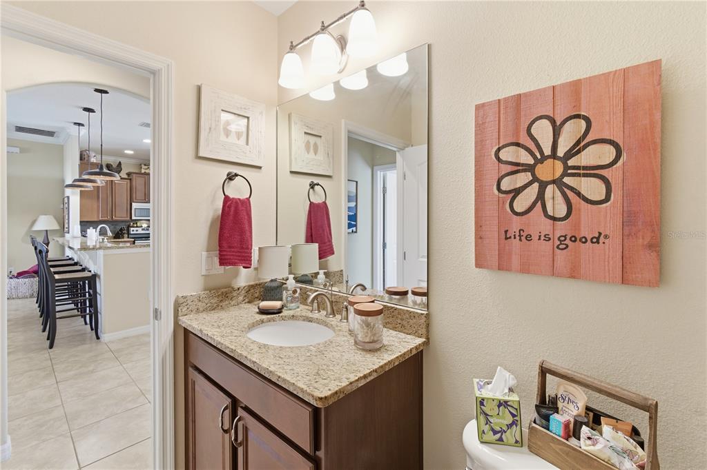 48 Evans Drive Palm Coast, FL 32164 - Photo 27 of 47 a bathroom with a sink vanity and a mirror