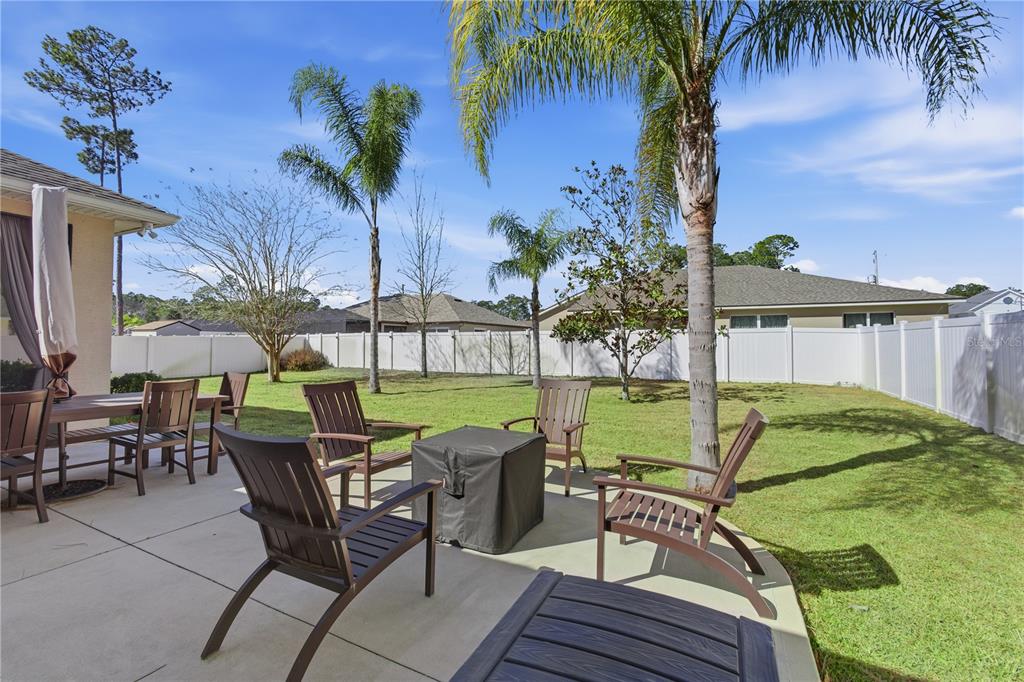 48 Evans Drive Palm Coast, FL 32164 - Photo 3 of 47 a view of a chairs and table in patio
