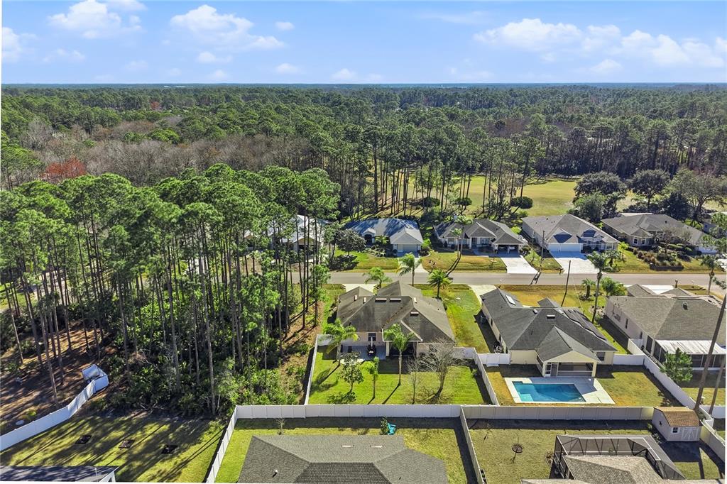 48 Evans Drive Palm Coast, FL 32164 - Photo 42 of 47 a view of swimming pool with outdoor seating and yard