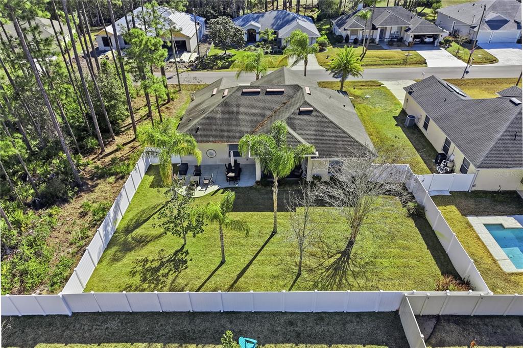 48 Evans Drive Palm Coast, FL 32164 - Photo 46 of 47 an aerial view of a swimming pool with a yard