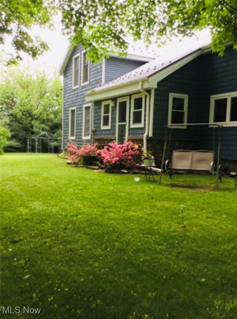 436 Keefus Road Conneaut, OH 44030 - Photo 24 of 30 Rear view of house with a yard