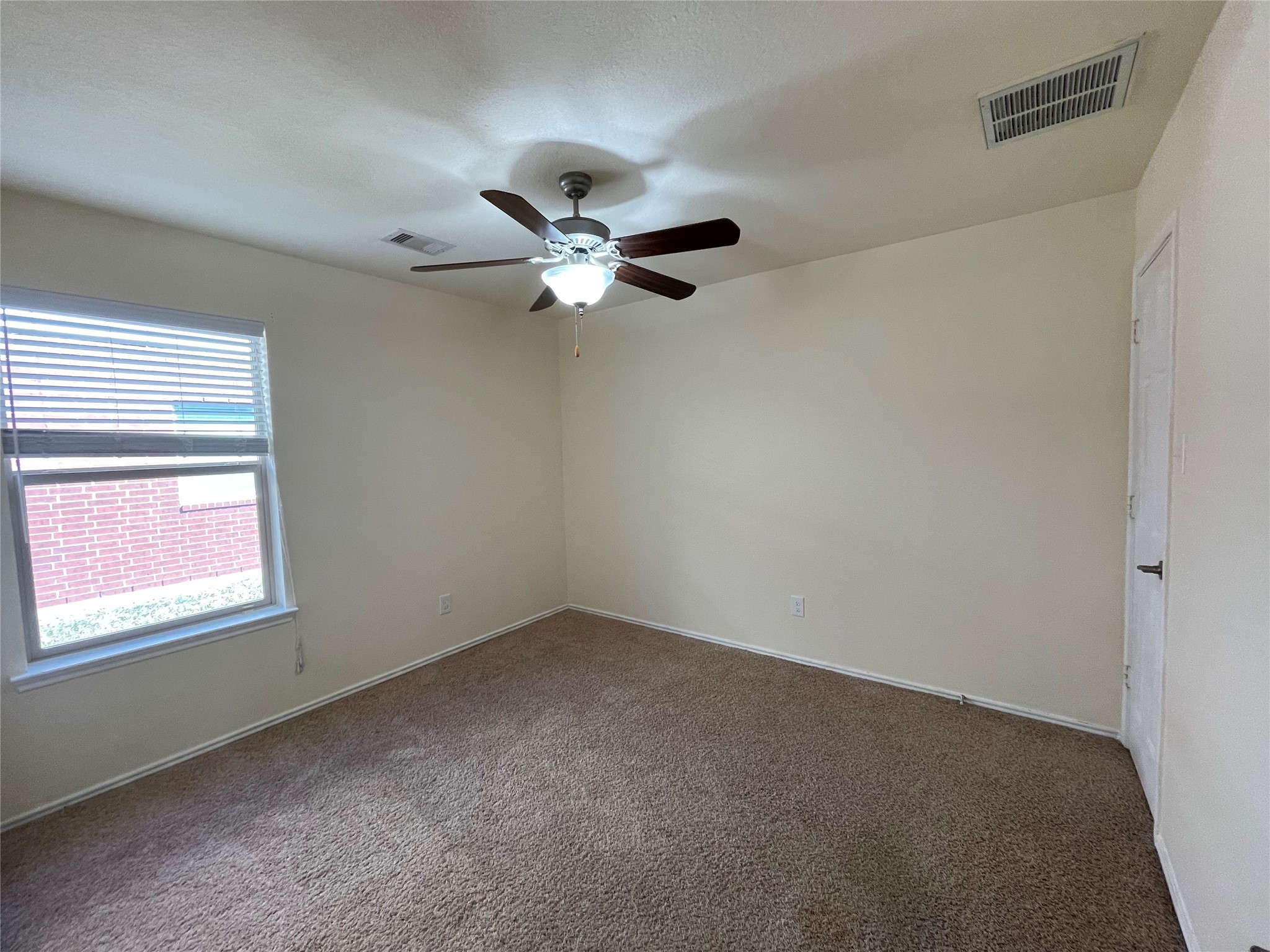 12010 Ramla Place Trail Houston, TX 77089 - Photo 15 of 24 an empty room with a window and a fan