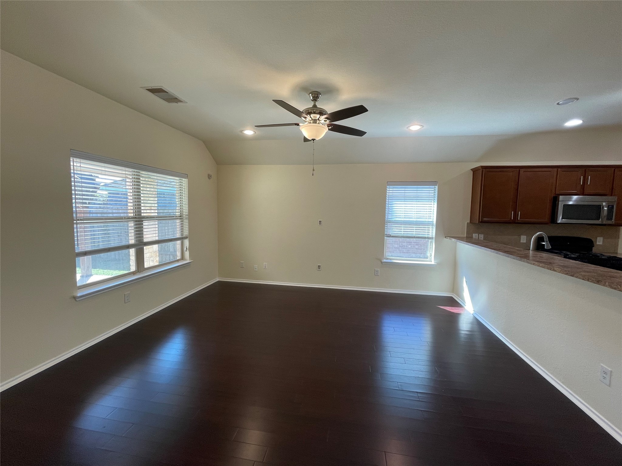 12010 Ramla Place Trail Houston, TX 77089 - Photo 7 of 24 a view of an empty room with wooden floor and a window