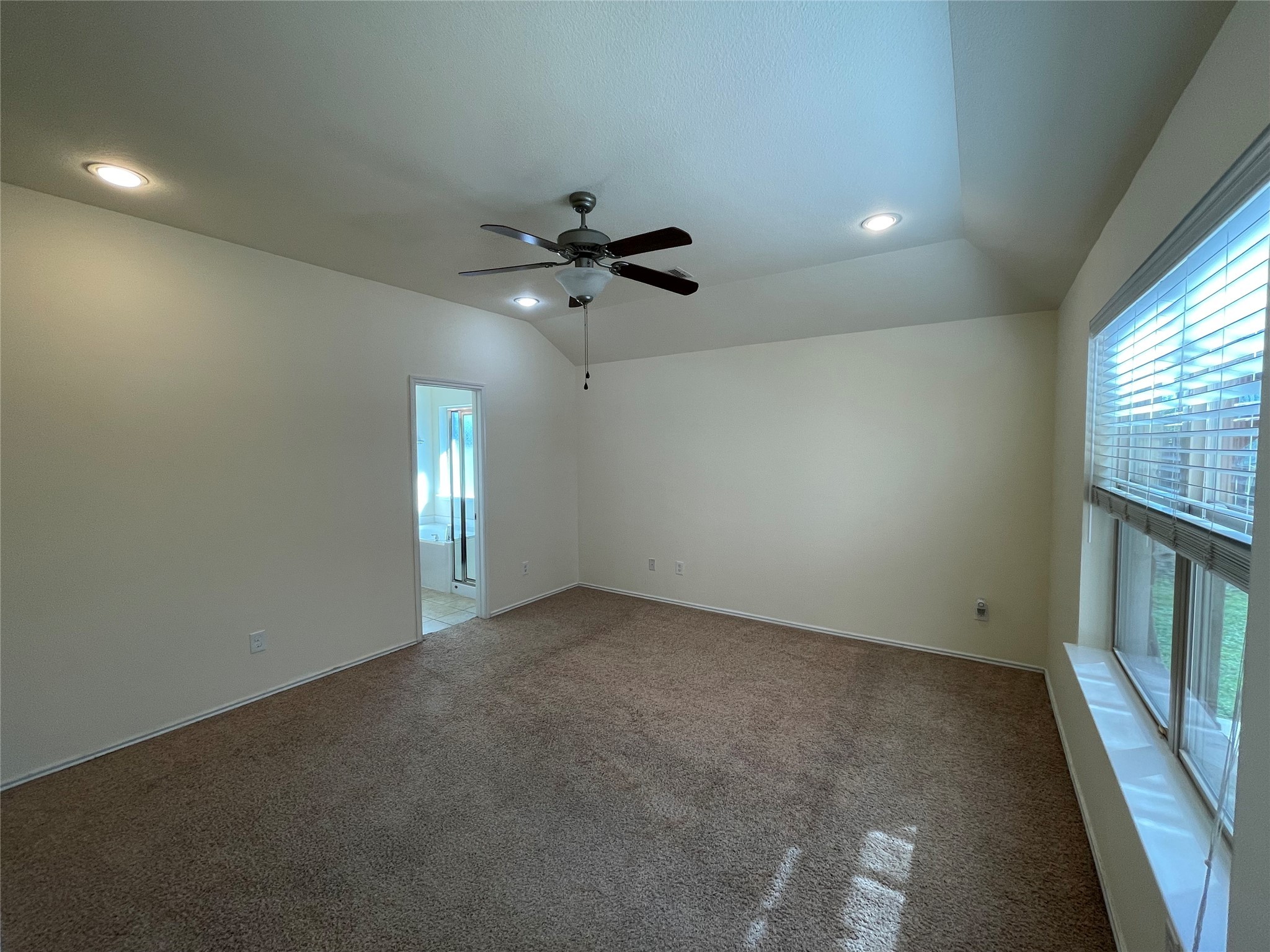 12010 Ramla Place Trail Houston, TX 77089 - Photo 10 of 24 an empty room with chandelier fan and windows