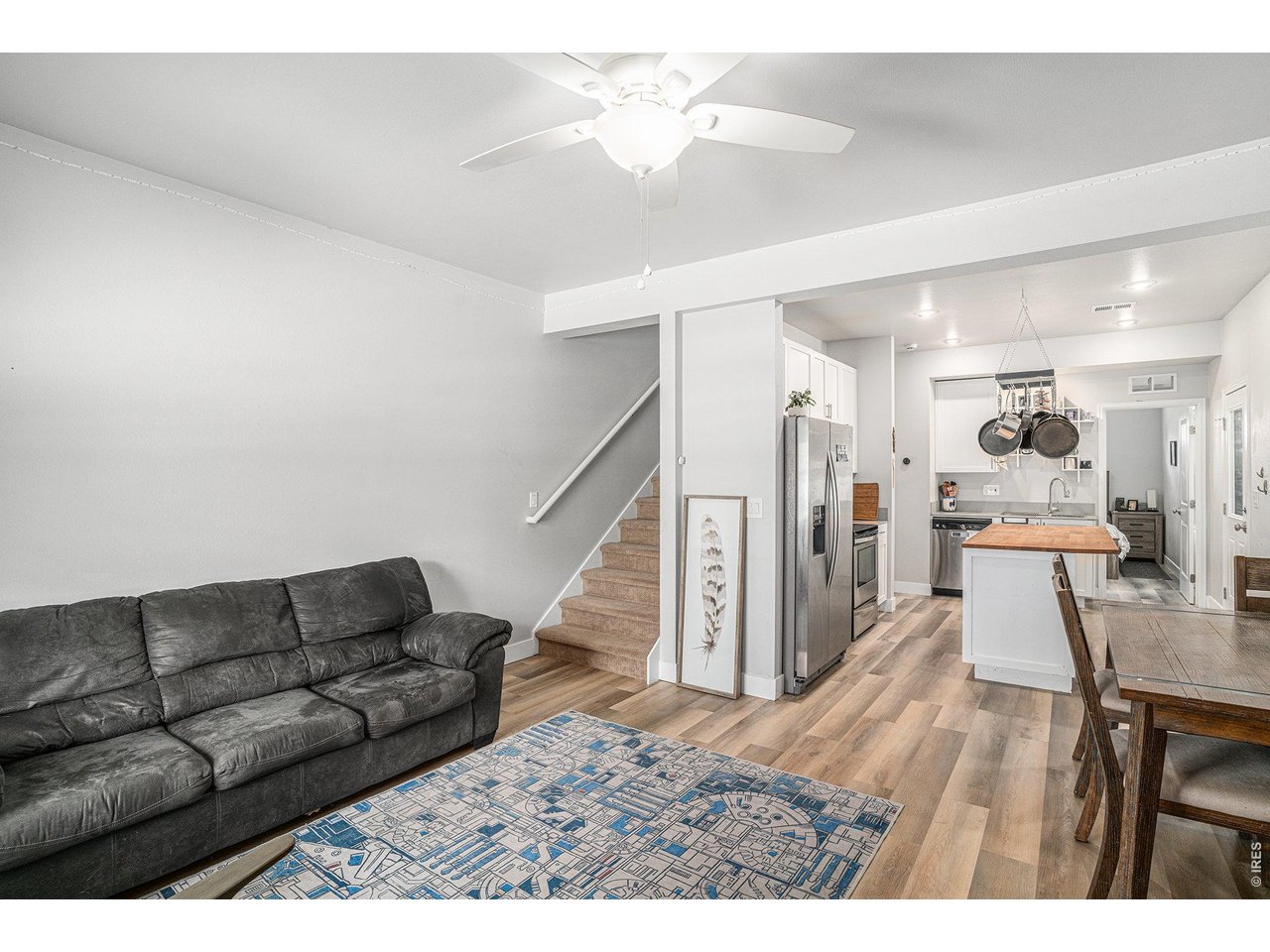 7775 5th Street, Unit 2 Wellington, CO 80549 - Photo 11 of 30 a living room with furniture and a wooden floor