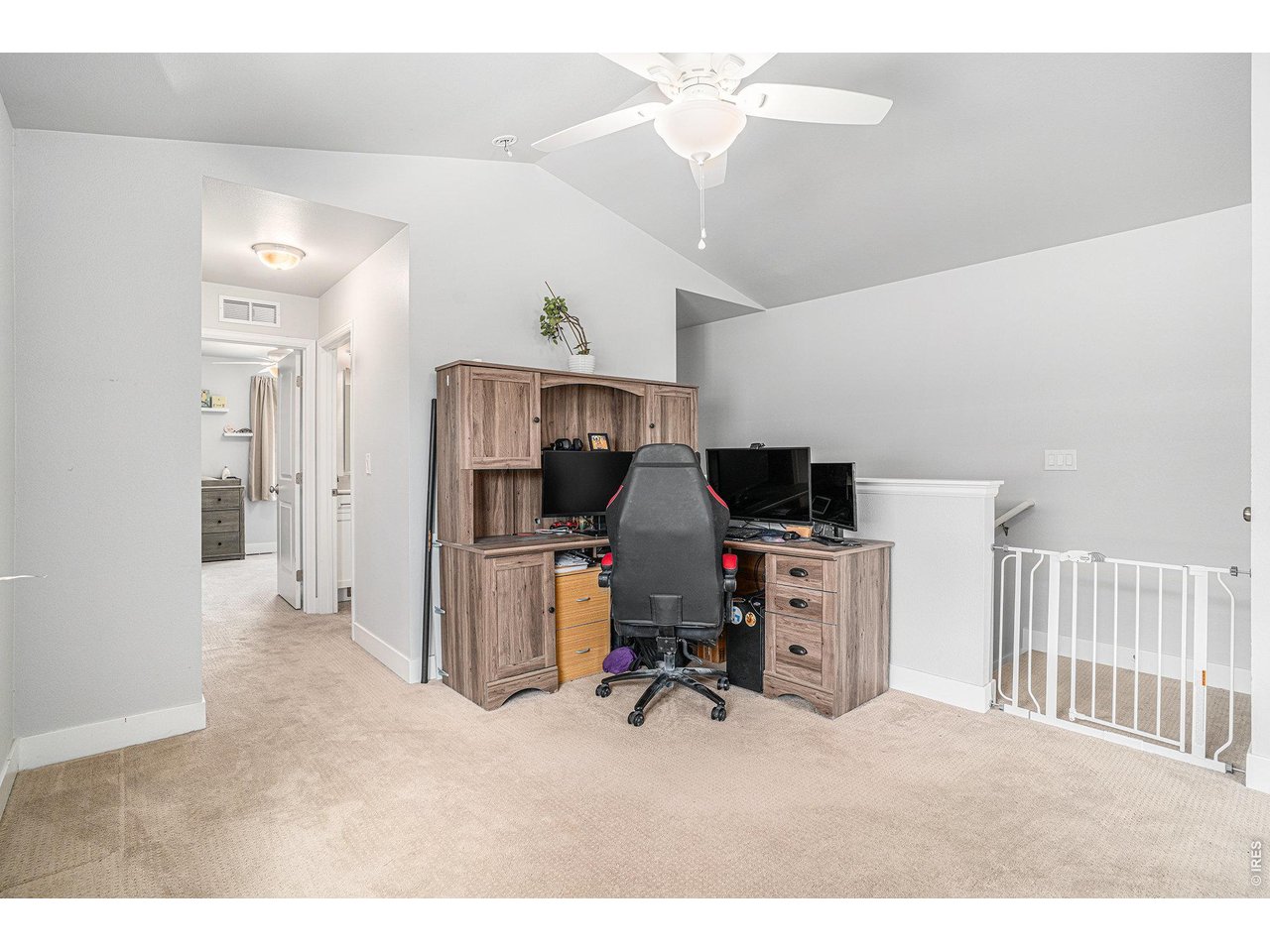 7775 5th Street, Unit 2 Wellington, CO 80549 - Photo 20 of 30 a view of a workspace with furniture and a ceiling fan