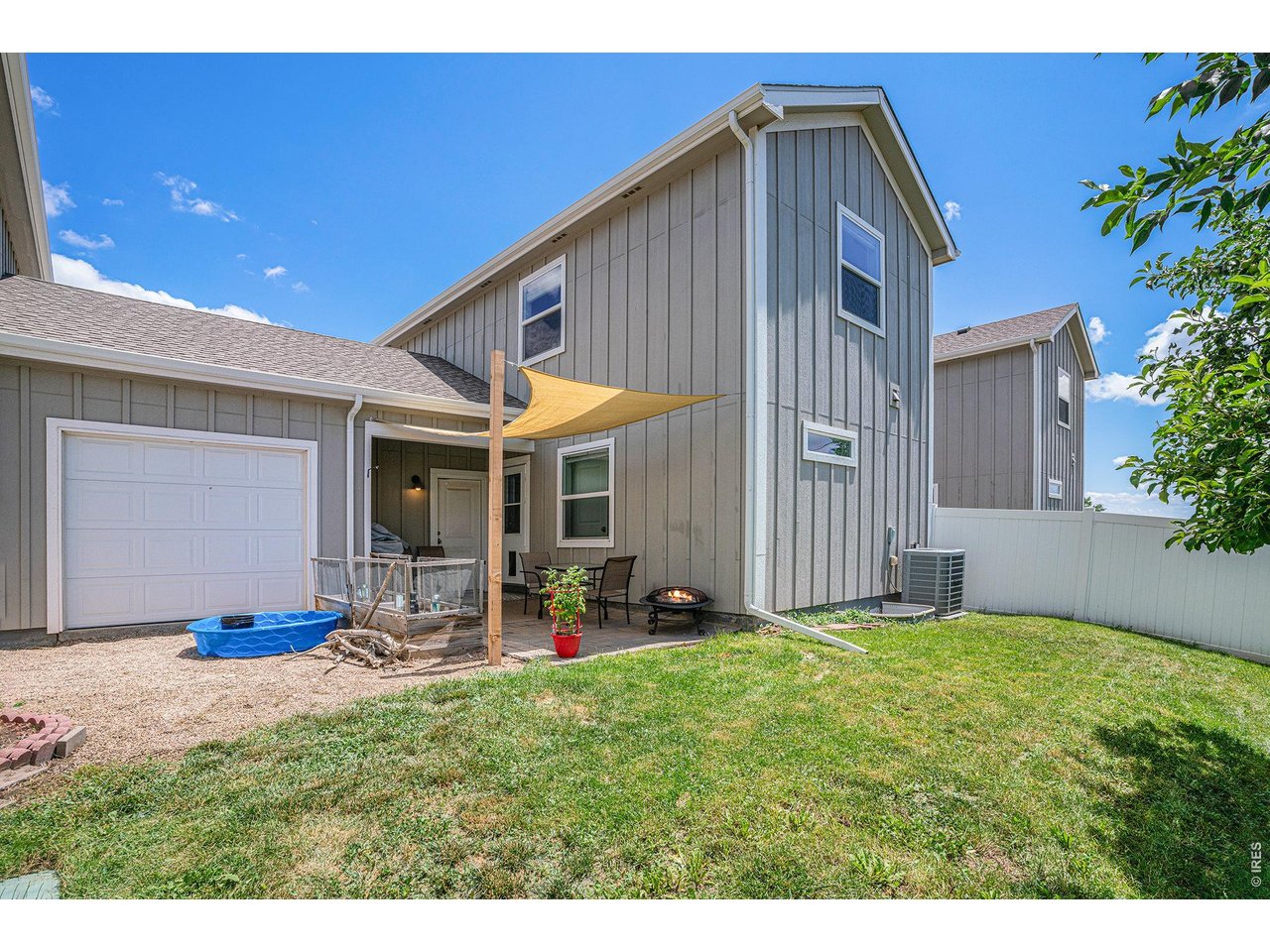 7775 5th Street, Unit 2 Wellington, CO 80549 - Photo 2 of 30 a backyard of a house with table and chairs