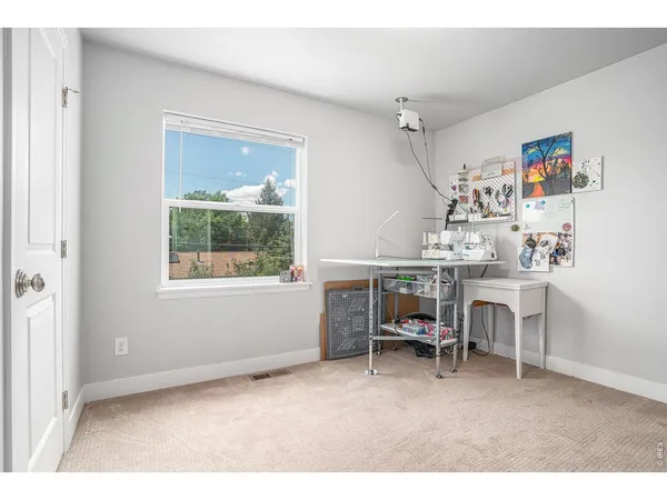 a workspace with furniture and a window