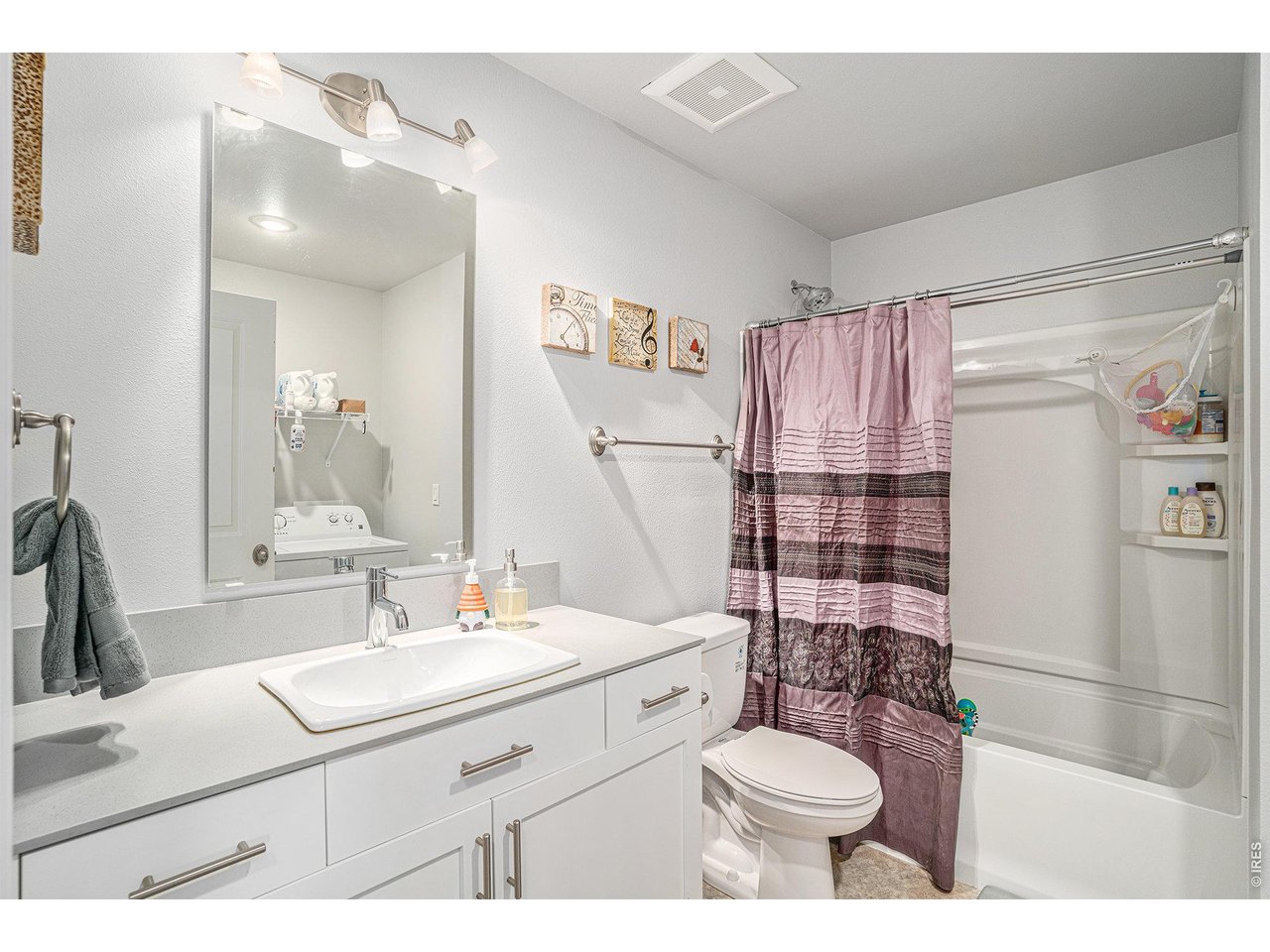 7775 5th Street, Unit 2 Wellington, CO 80549 - Photo 24 of 30 a bathroom with a sink toilet and shower