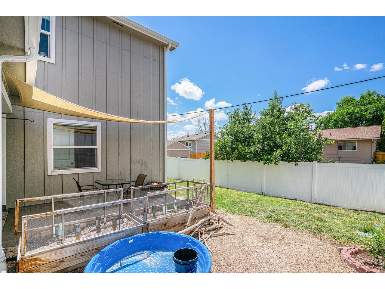 7775 5th Street, Unit 2 Wellington, CO 80549 - Photo 29 of 30 a view of backyard with swimming pool and outdoor seating