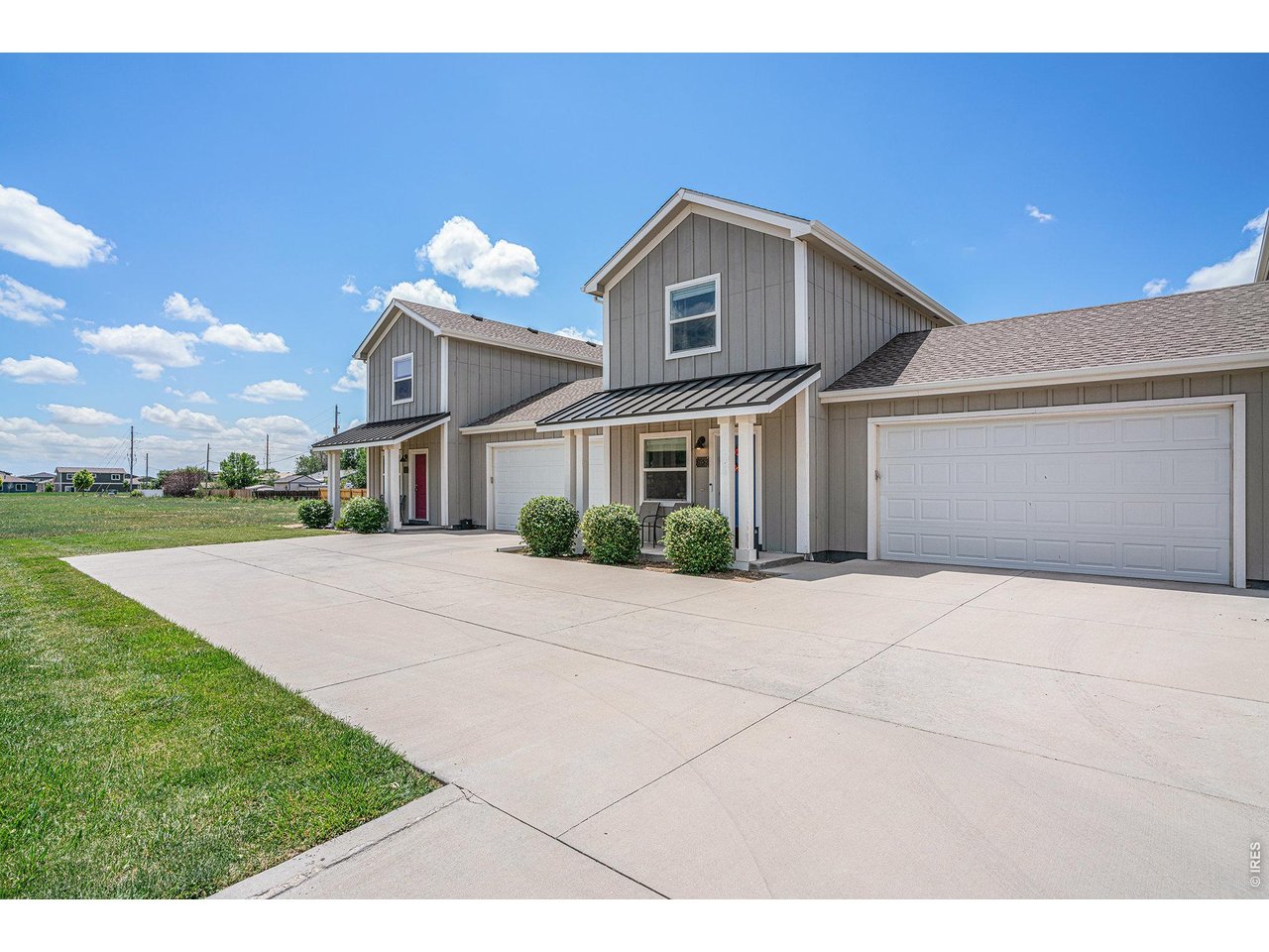 7775 5th Street, Unit 2 Wellington, CO 80549 - Photo 5 of 30 a front view of a house with a yard