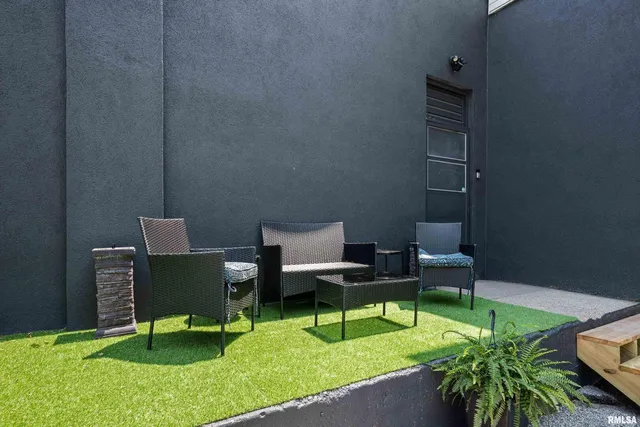 a backyard of a house with seating space