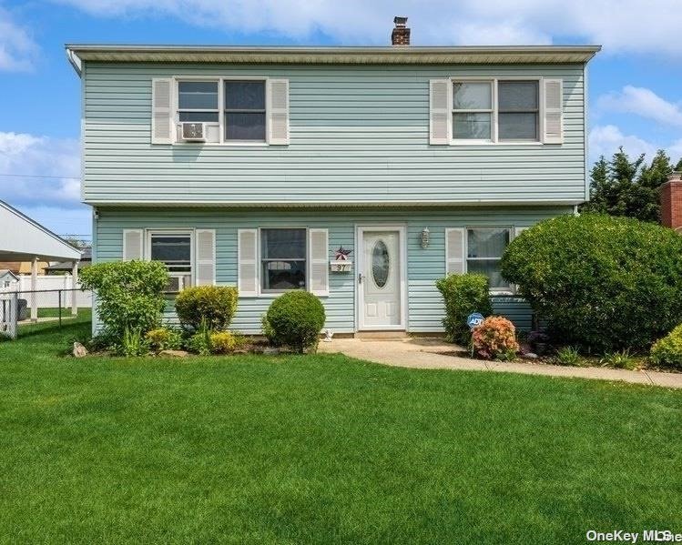 97 Azalea Road Levittown, NY 11756 - Photo 1 of 1 a view of a house with a yard and sitting area
