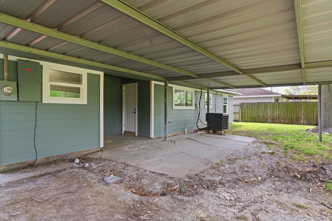 2208 Merle Street Pasadena, TX 77502 - Photo 25 of 26 a view of a house with a backyard and a garage