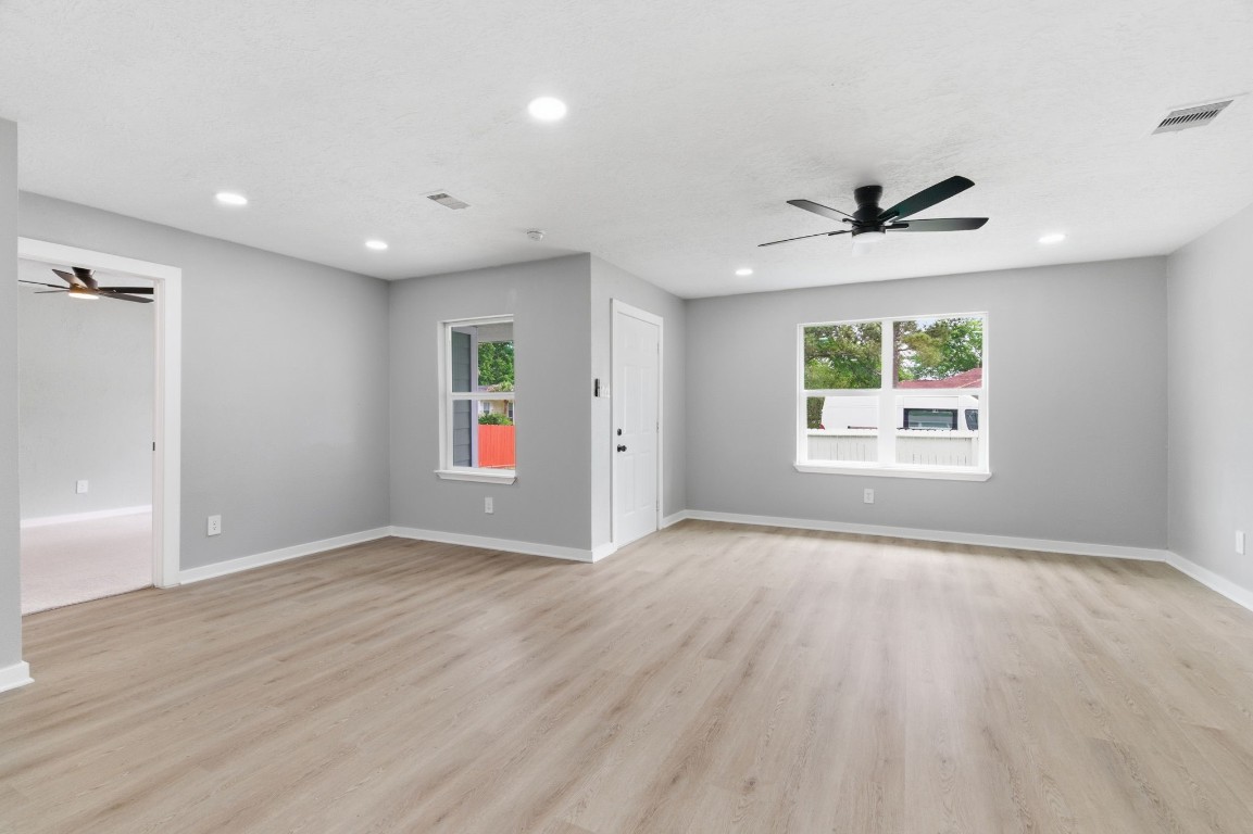 2208 Merle Street Pasadena, TX 77502 - Photo 6 of 26 an empty room with windows and entrance