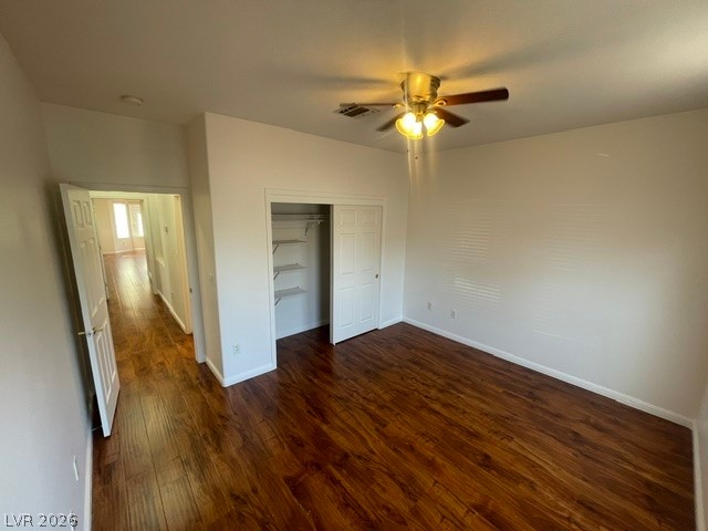 3047 Hickory Valley Road Henderson, NV 89052 - Photo 10 of 21 Rich hardwood-style flooring and a ceiling fan with integrated lighting define this inviting bedroom space.