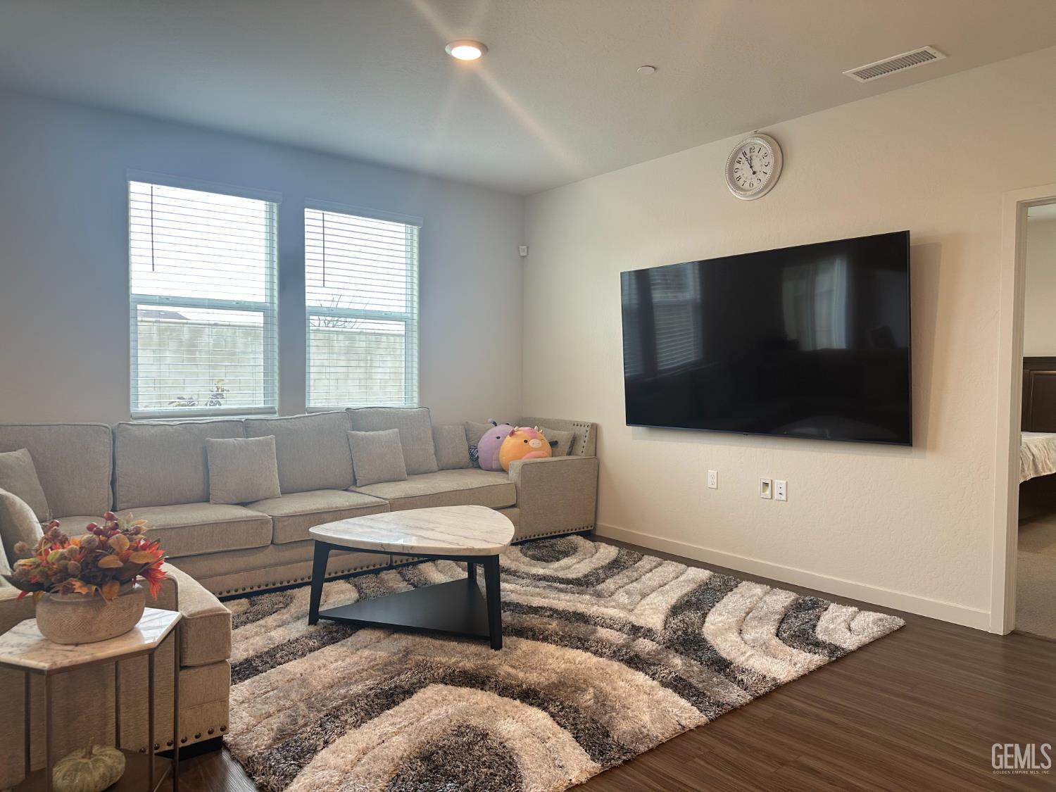 Undisclosed Address Hanford, CA 93230 - Photo 11 of 26 a living room with furniture and a flat screen tv