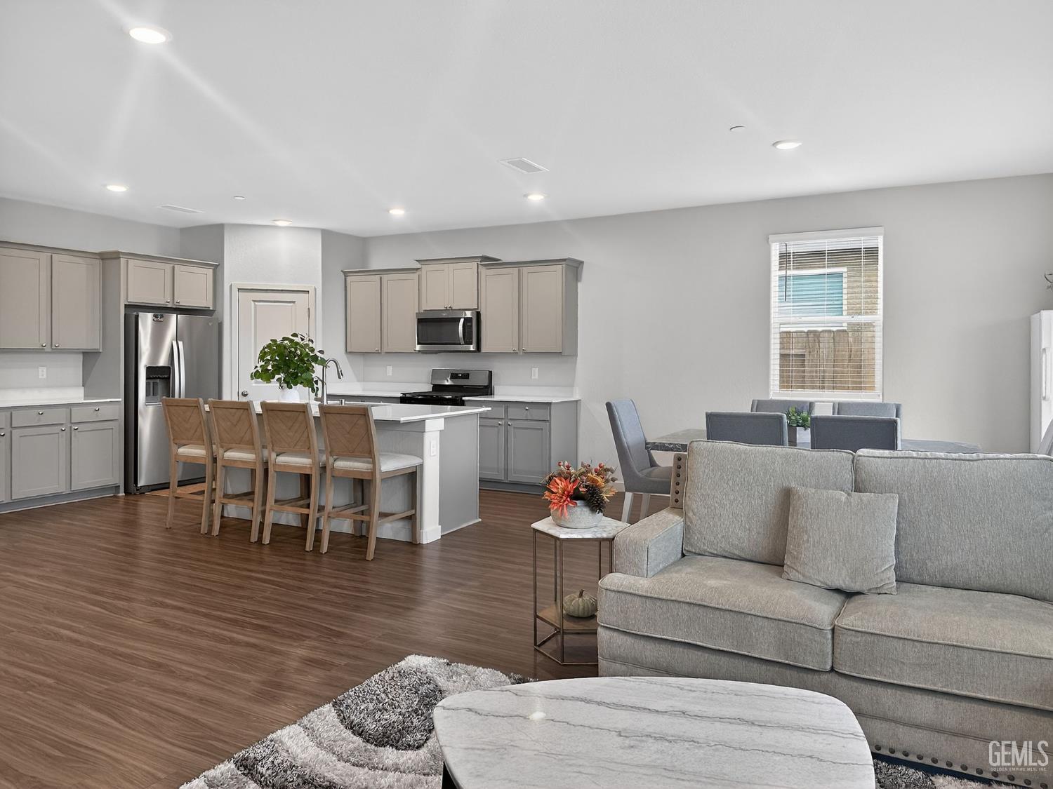 Undisclosed Address Hanford, CA 93230 - Photo 13 of 26 a living room kitchen with furniture and a dining table with kitchen view