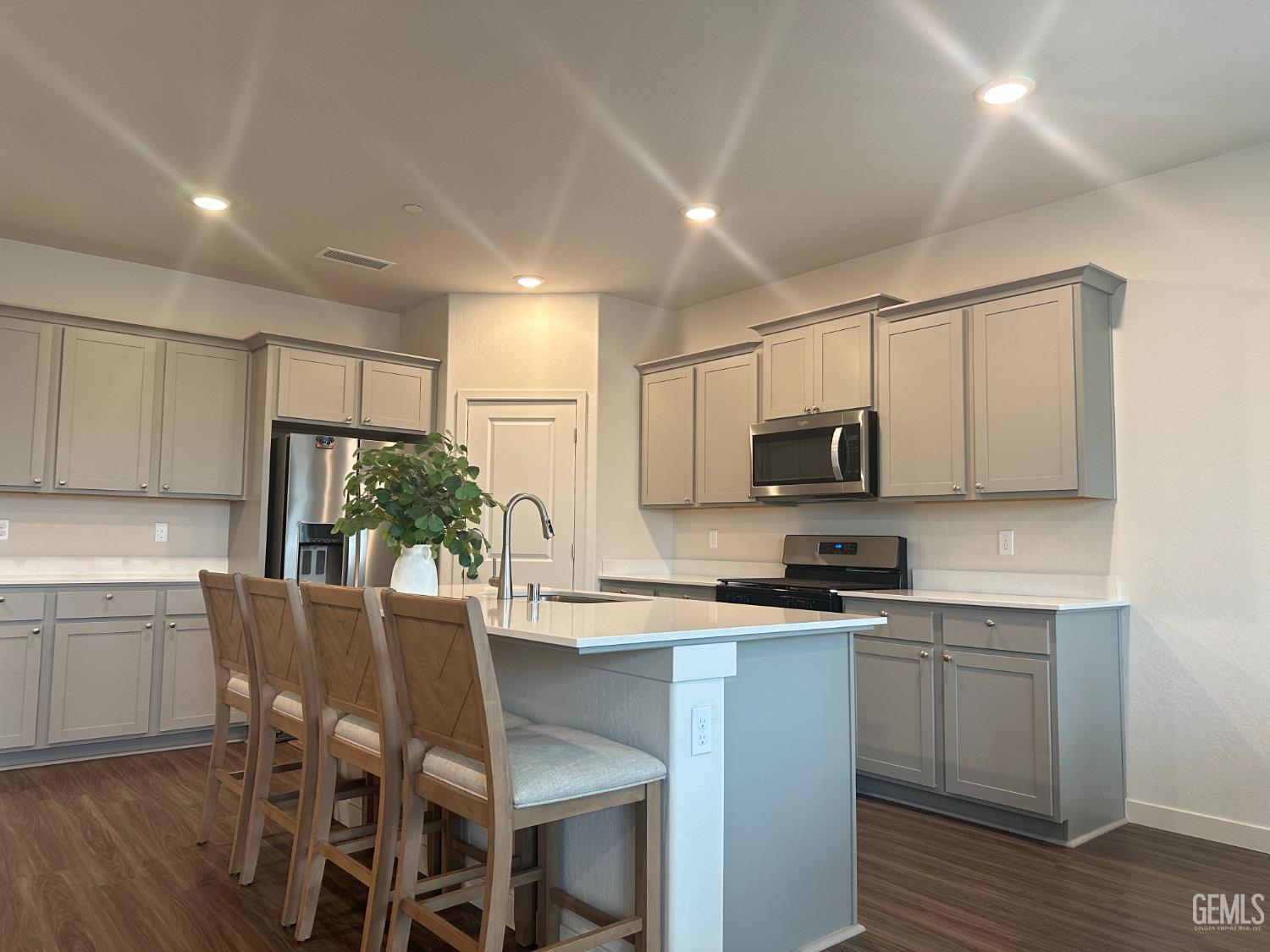 Undisclosed Address Hanford, CA 93230 - Photo 15 of 26 a kitchen with a sink a microwave and cabinets