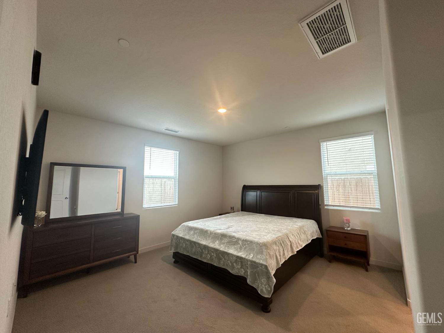 Undisclosed Address Hanford, CA 93230 - Photo 20 of 26 a bedroom with a bed and a window