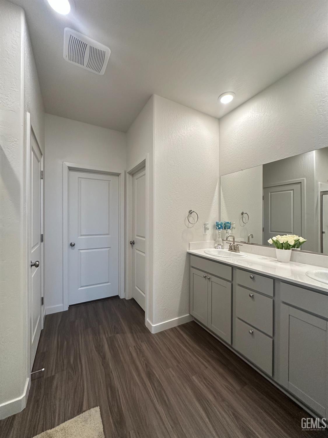 Undisclosed Address Hanford, CA 93230 - Photo 21 of 26 a bathroom with a double vanity sink and mirror