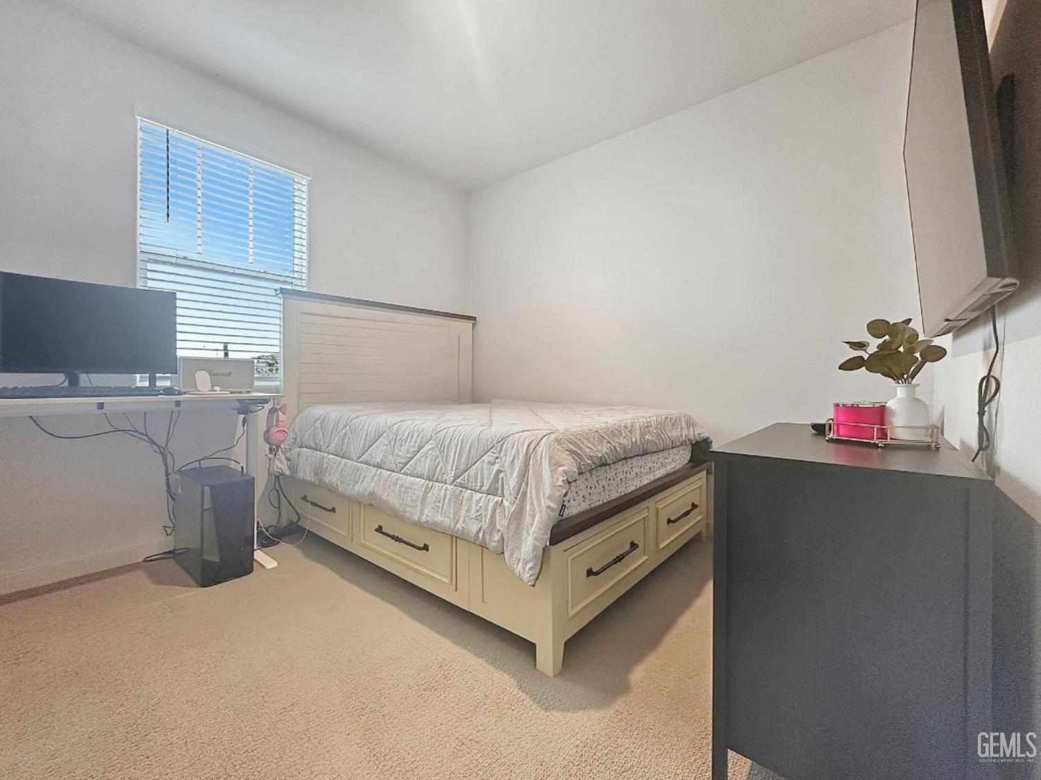Undisclosed Address Hanford, CA 93230 - Photo 23 of 26 a bedroom with a bed and a flat screen tv
