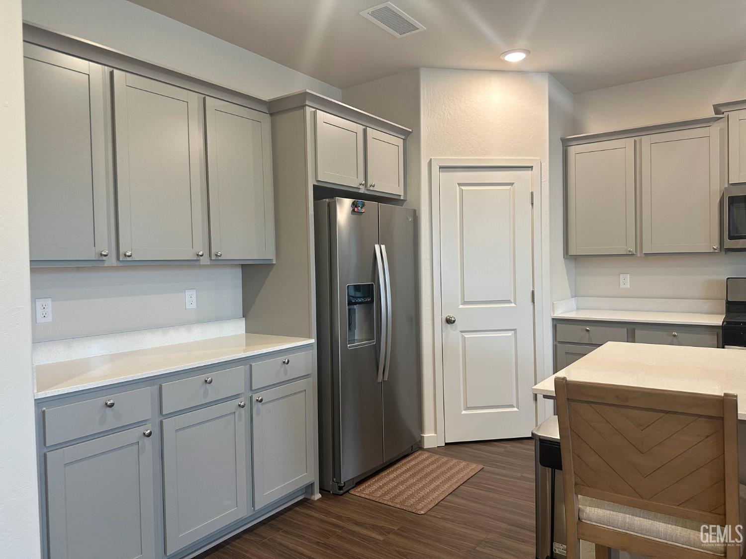 Undisclosed Address Hanford, CA 93230 - Photo 6 of 26 a kitchen with a refrigerator sink and cabinets