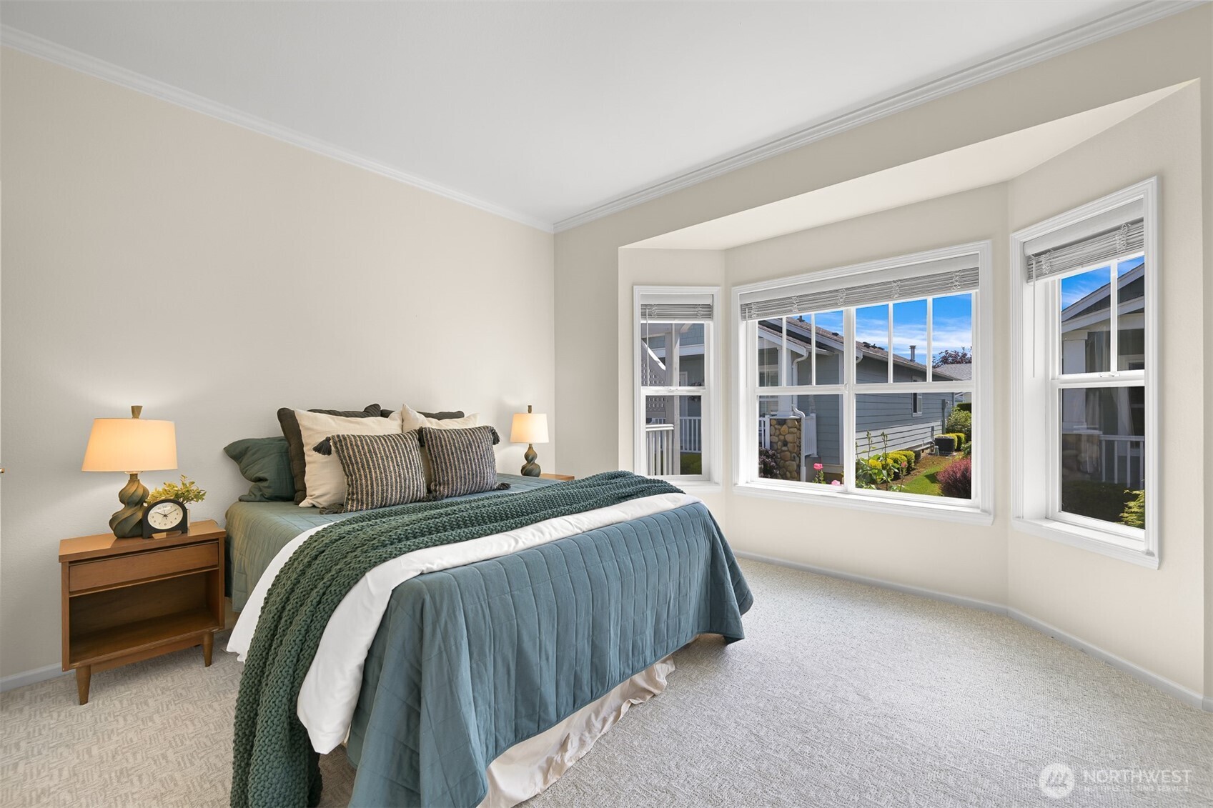 500 Fieldstone Loop, Unit 14 Lynden, WA 98264 - Photo 14 of 25 a spacious bedroom with a bed and a large window