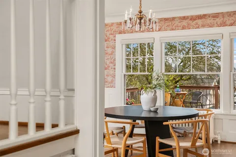 a view of a dining room with furniture and window