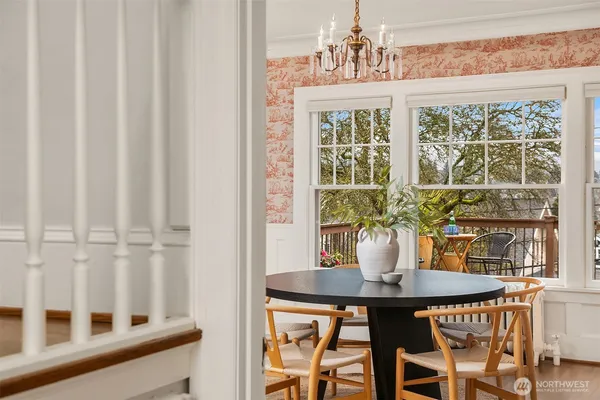 a view of a dining room with furniture and window