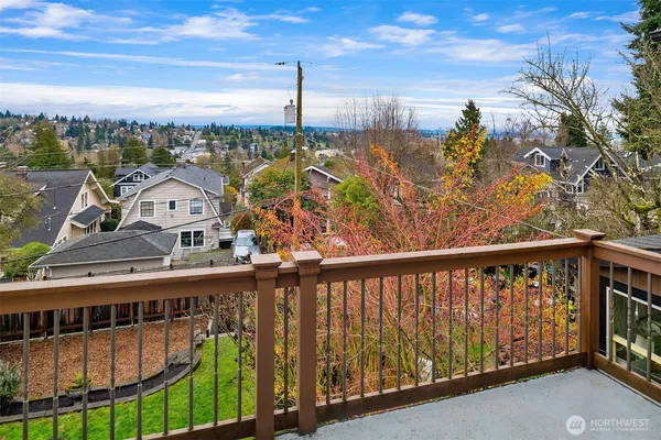 a view of a balcony with wooden floor