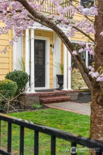 a view of brick house with a large windows