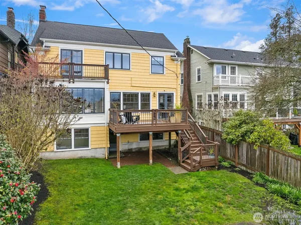 a view of a house with a yard and sitting area